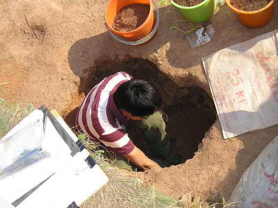 Yijie digging a pit